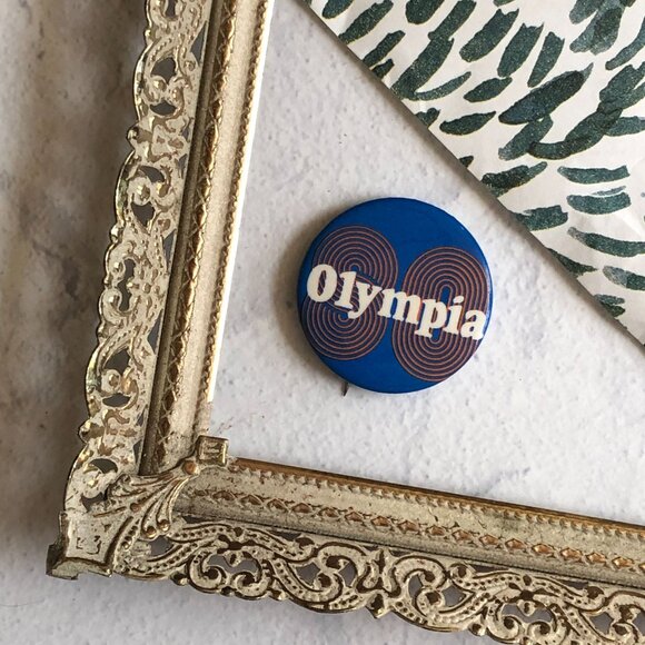 Vintage Olympia Blue Pinback Button Retro Orange 80 Collectible Memorabilia - Picture 2 of 4